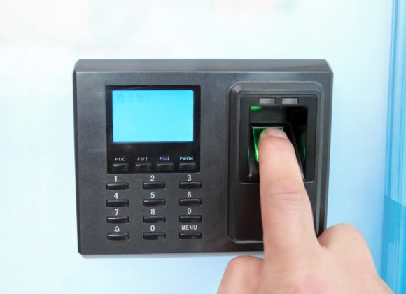 Door Access Systems in Arvada being open with a fingerprint scanner